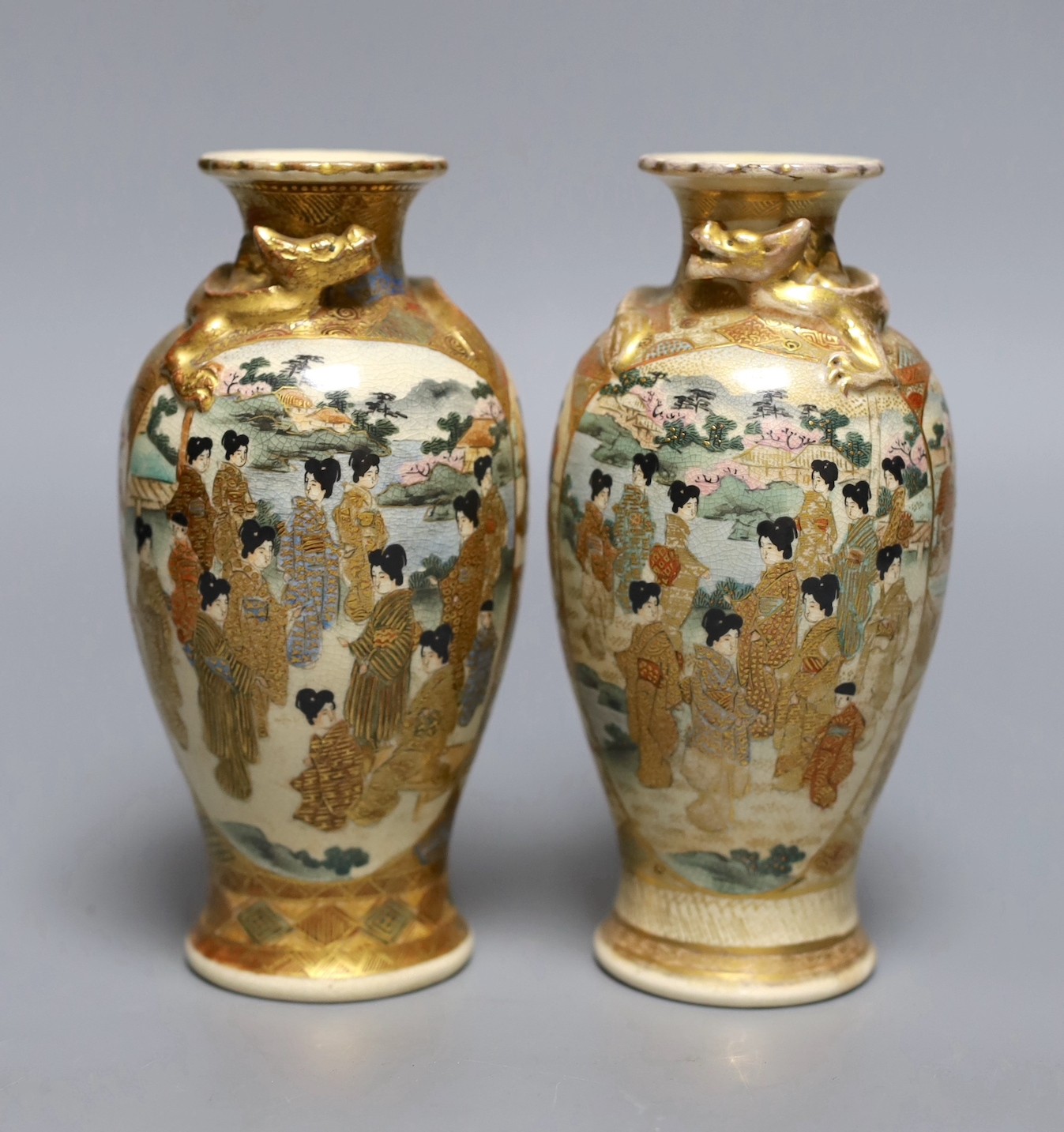 A pair of Japanese Satsuma pottery small vases, Meiji period, 18cms high